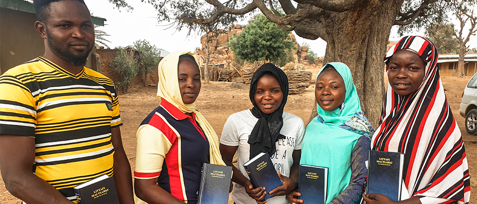 Young people with their new Bibles