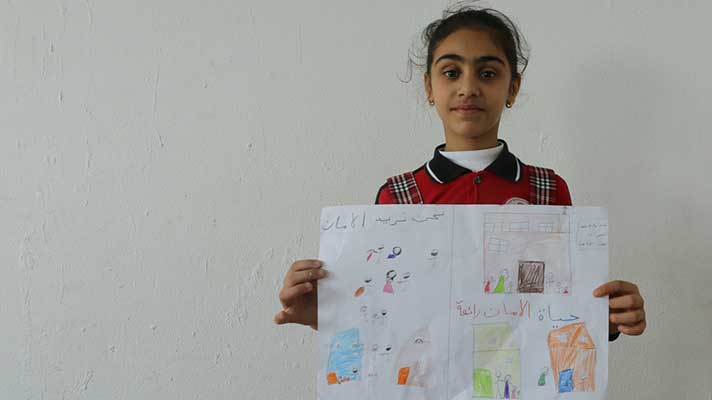 Malak, 11, drew Qaraqosh with lots of colours.