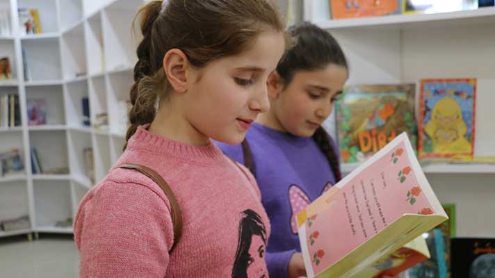 Two girls in Qaraqosh library