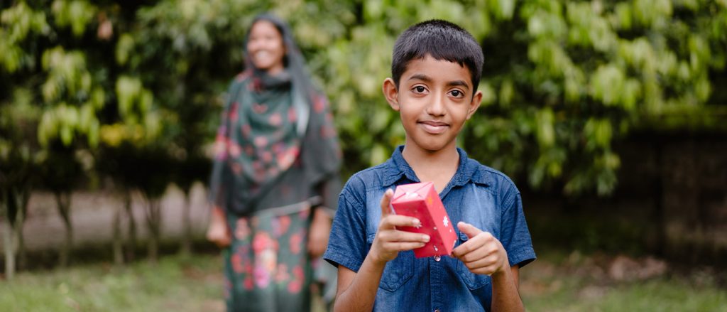 Robin holding a Christmas present