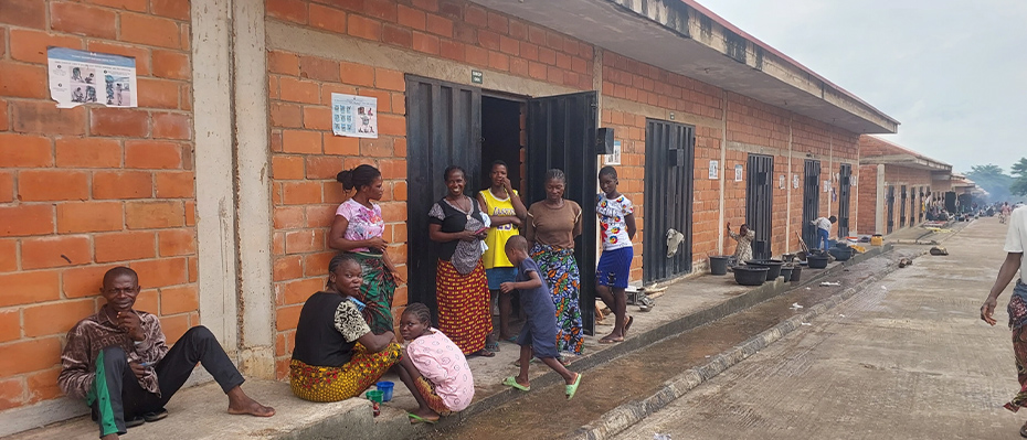 People sat outside a building in Nigeria