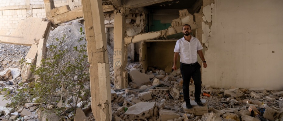Man stood in rubble
