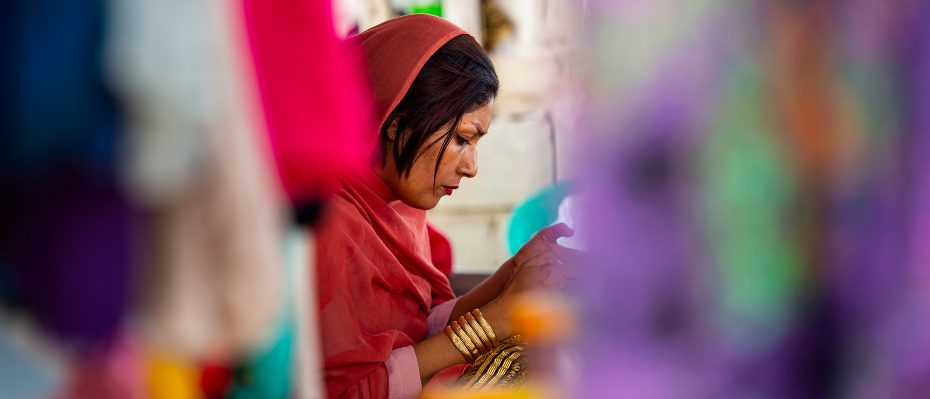 Woman wearing a headscarf looking down